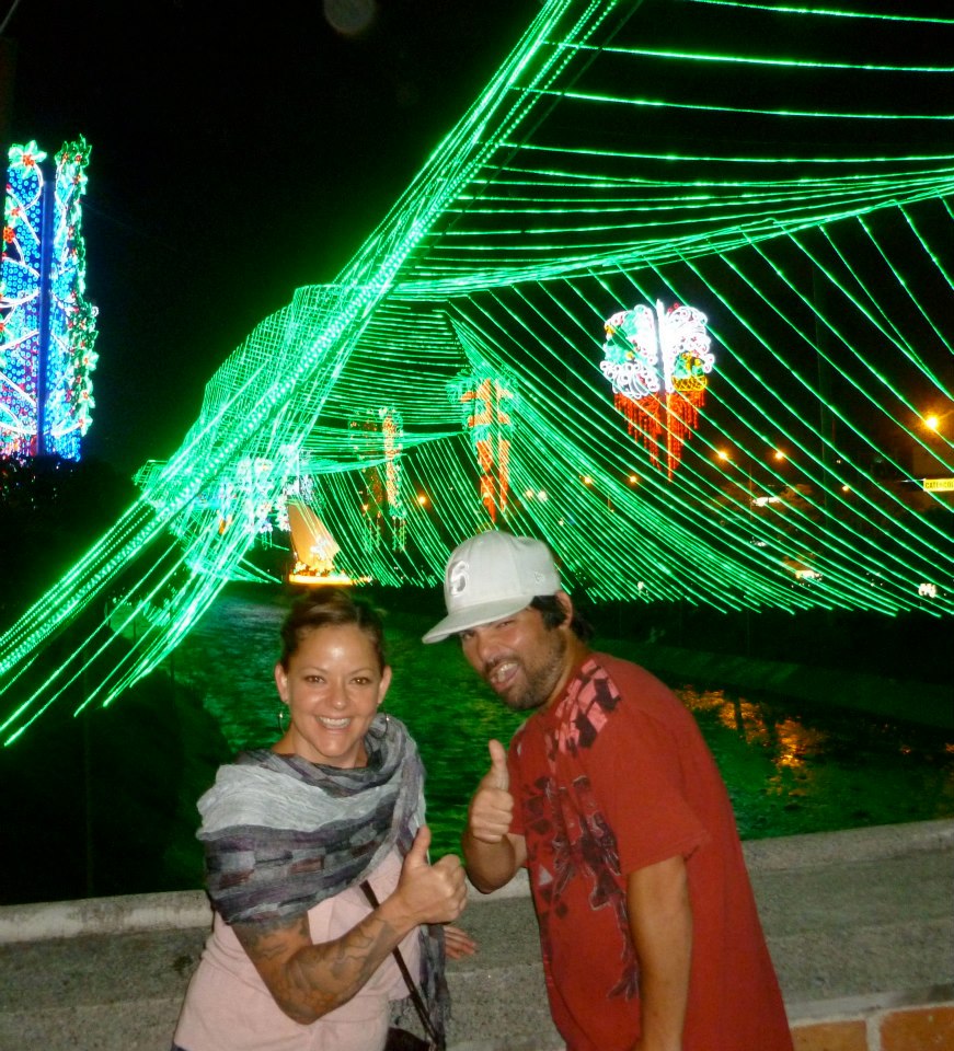 My sister and I being silly by the Christmas lights