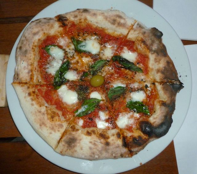 It's a simple pie, just basil, oregano, cheese and tomato sauce. But it's such a good pie.
