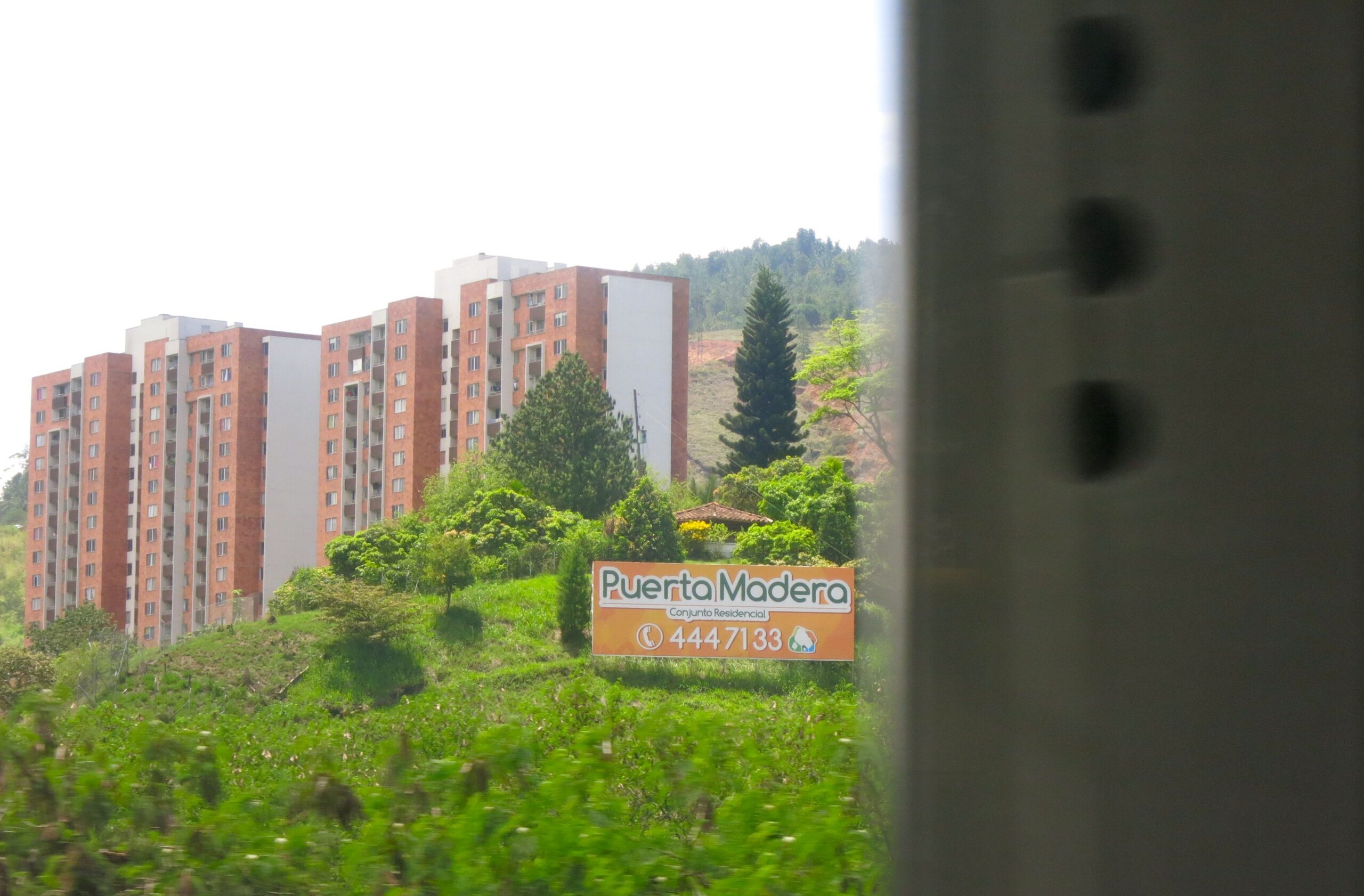 This new development, Puerta de Madera, means Door to Madera, fitting since I took this picture through tight window while riding the Metro. 