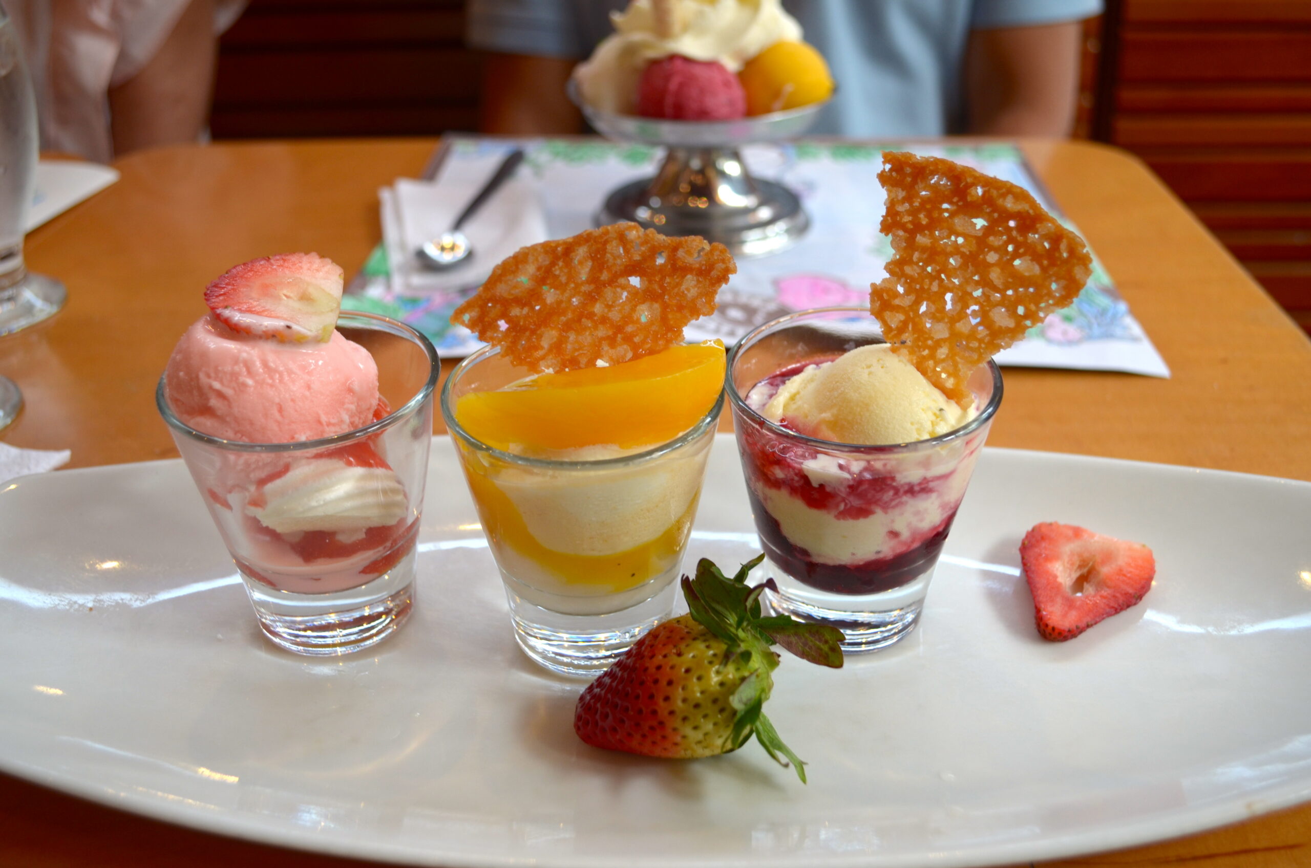 Artesanal ice-cream. Flavors in order: Rose petal with strawberry and merengue; __ with maracuyá and peach; __ with blackberry.
