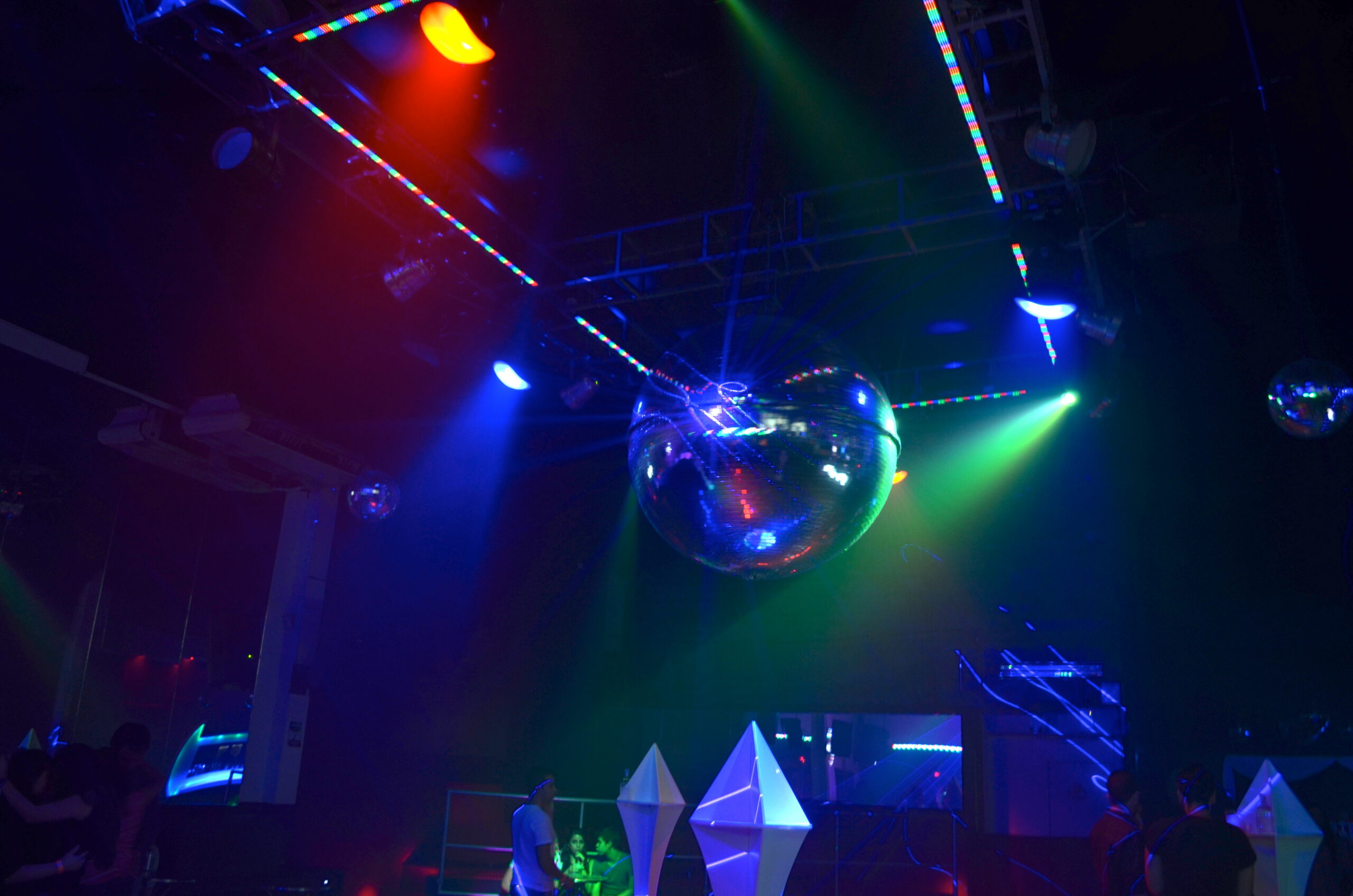 Purple Giant disco ball in the center of the club.