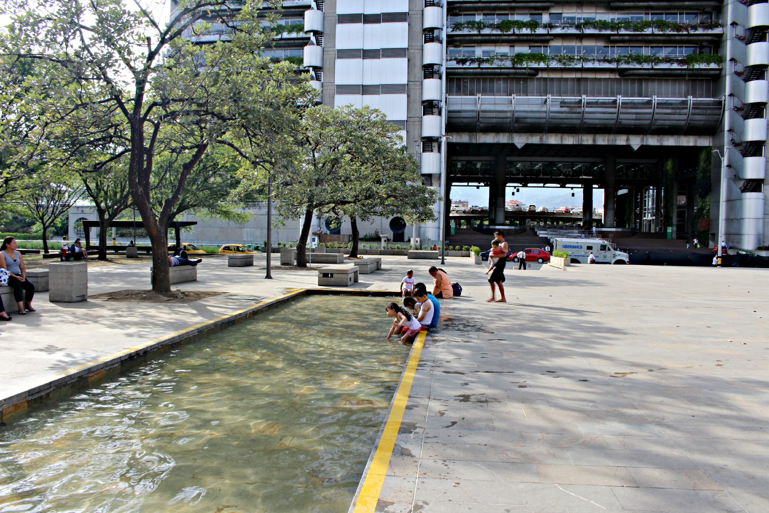 Plaza Locals enjoying a wading pool in the plaza