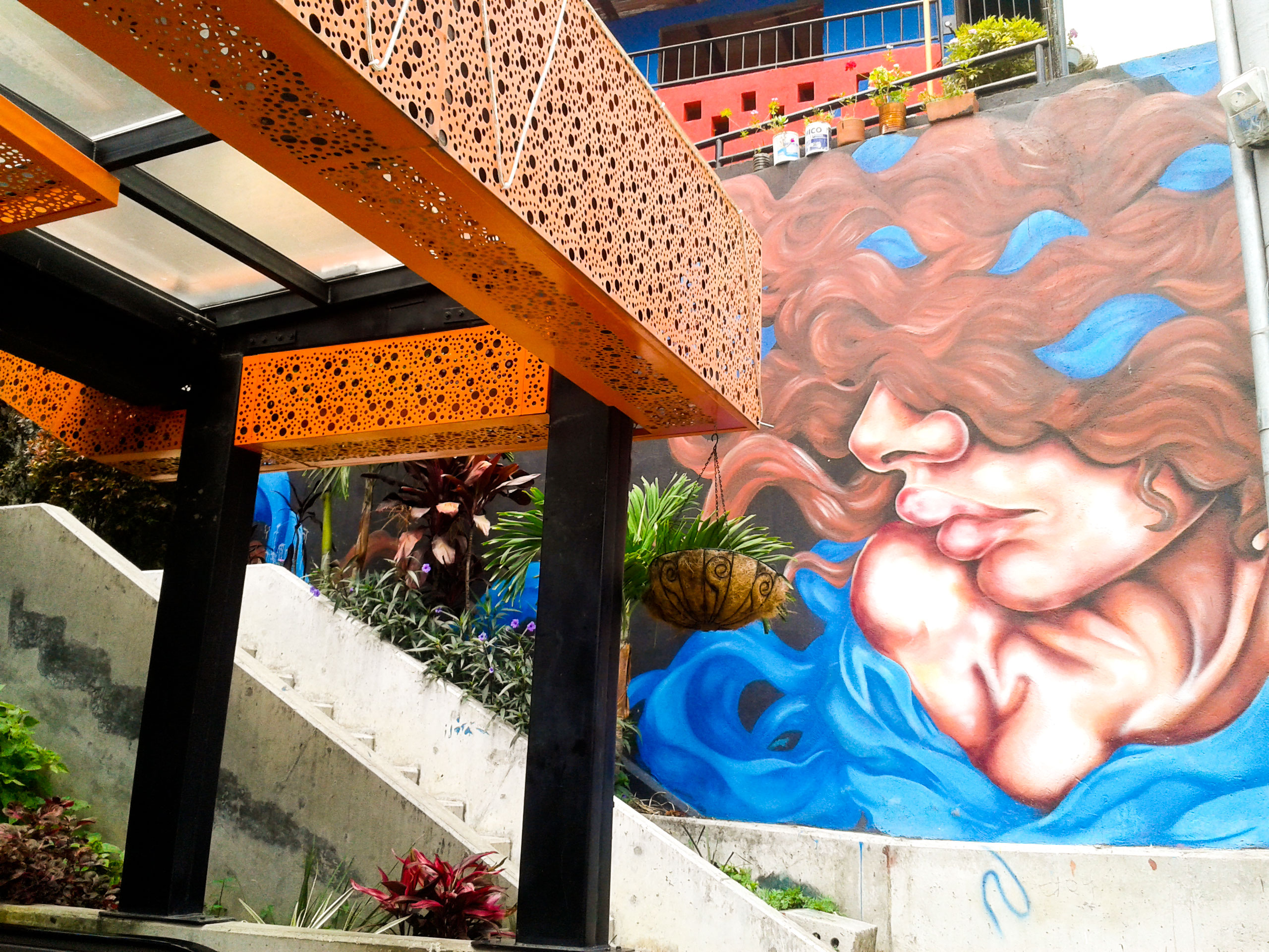 Street art Paola Delfín's work at the foot of the escalators.