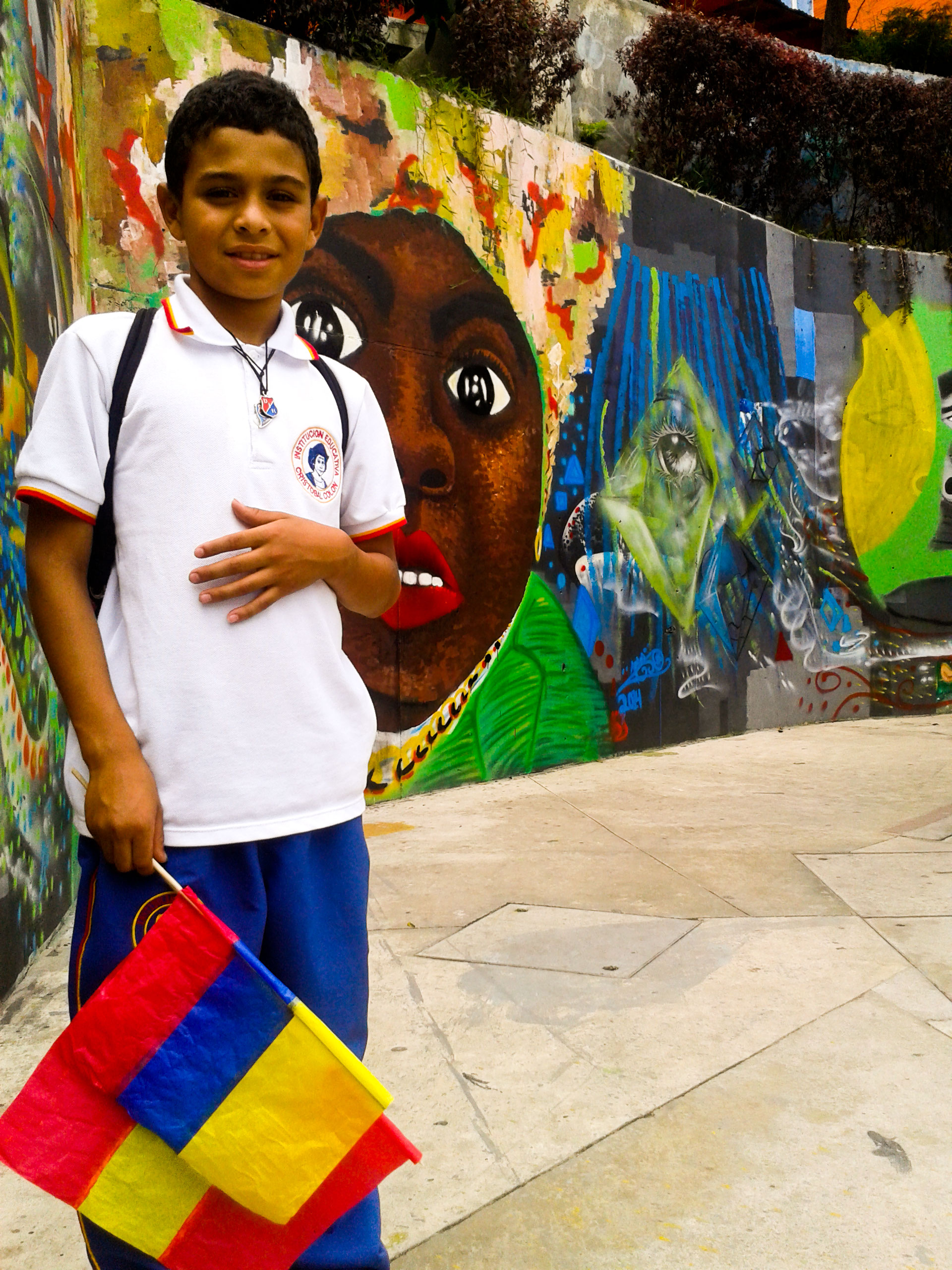 Child A child, resident of comuna 13, posing for a photo after school.