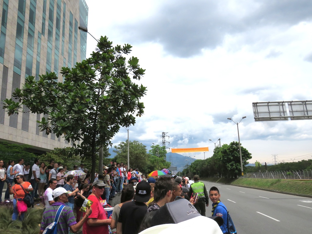 Watching the parade in front of Bancolombia’s headquarters building
