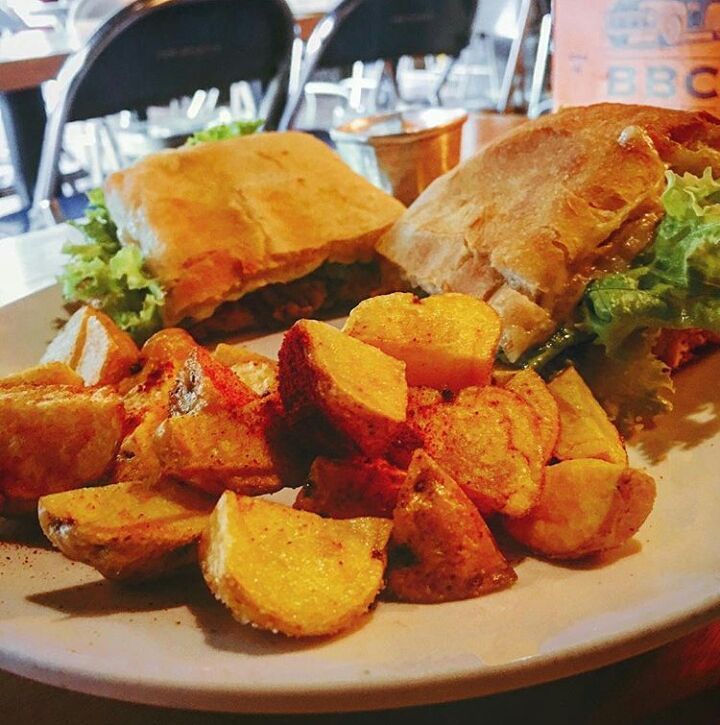 Pulled Pork Sandwich at Barrio Central, comes with traditional potato called papa criolla.