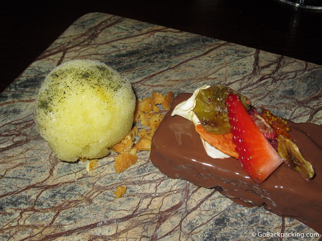 Dessert Lulo and tequila sorbet accompanies a chocolate cake garnished with dried fruits