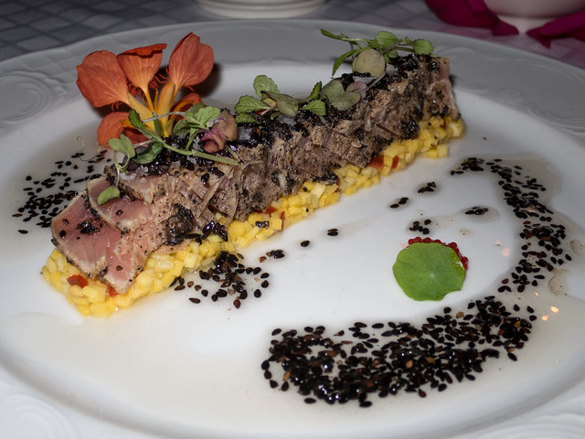 Tuna tataki on mango and sweet chili tartar with black sesame dressing