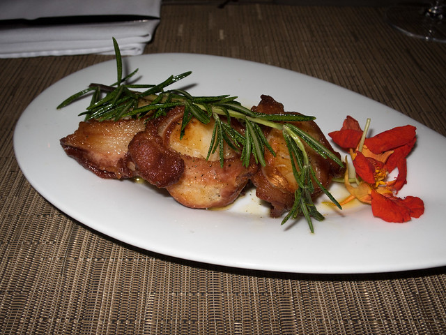 Bacon-wrapped scallops bathed in melted butter