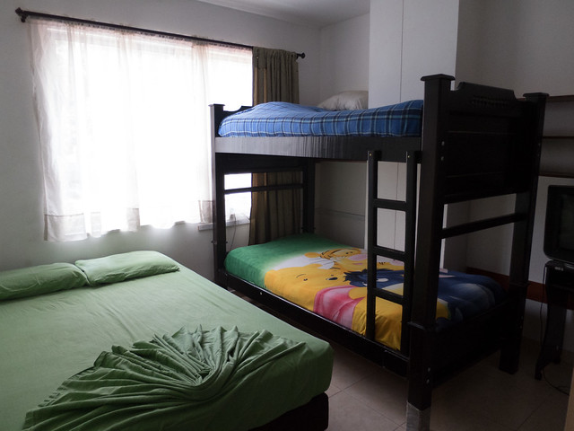 Dorm room A typical room featuring a queen size bed and bunk bed