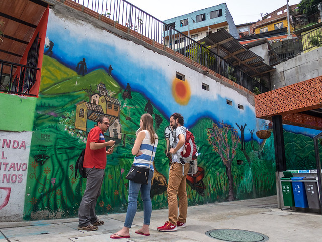 David, our guide, talks about the street art around the escalators
