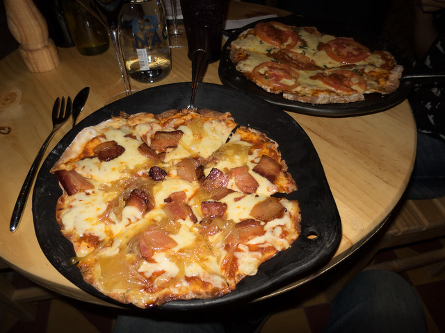 Thin crust pizza Smoked pancetta and caramelized onion pizza