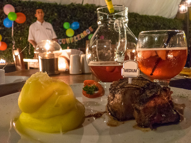 A perfectly cooked tenderloin, with a side of mashed potatoes