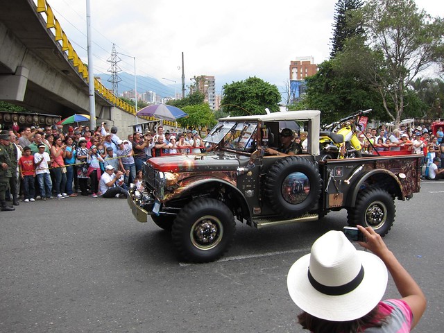 A military-themed truck features a fake RPG on the side, and a motorbike in the back!