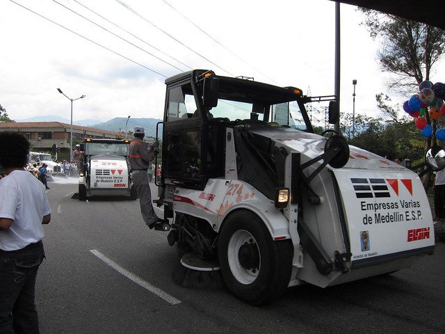 At the end of the parade, a bunch of street cleaners swept through to wash down the road and collect the trash.