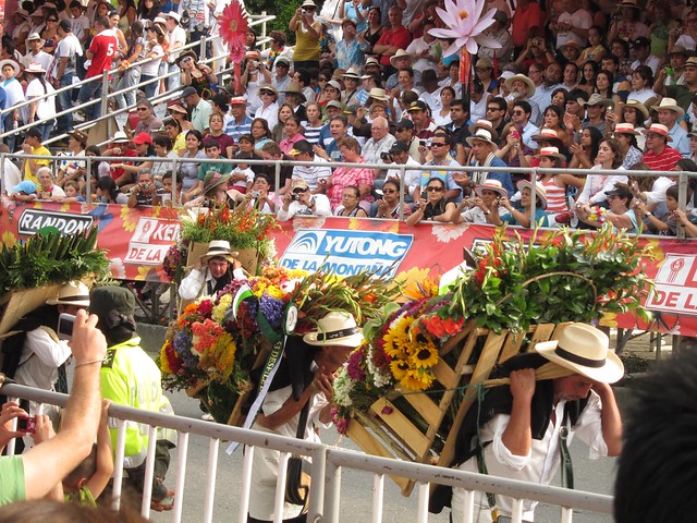 Carrying flowers in the parade does not look easy. At least it was a cloudy day, otherwise the strong sun would've made it that much harder. Carrying flowers in the parade does not look easy. At least it was a cloudy day, otherwise the strong sun would've made it that much harder.