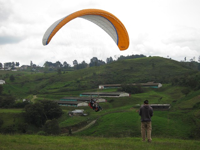 A paraglider comes in for a landing. A paraglider comes in for a landing.