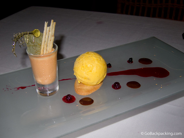 Passion fruit ice cream, tangerine mousse, and Aguardiente-flavored cookie with a strawberry coulis and touch of chocolate sauce. Passion fruit ice cream, tangerine mousse, and Aguardiente-flavored cookie with a strawberry coulis and touch of chocolate sauce.