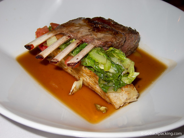 New Zealand rack of lamb served over purple potato cake and sauteed vegetable juices. New Zealand rack of lamb served over purple potato cake and sauteed vegetable juices.