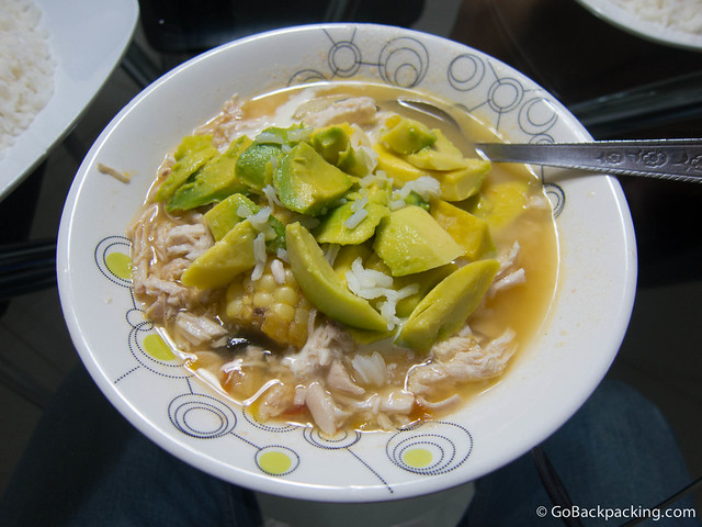 Ajiaco Ajiaco, ready to serve with white rice and fresh avocado