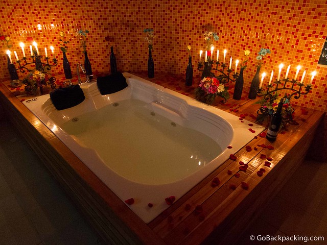 Jacuzzi Candlelit jacuzzi with flowers and a bottle of wine