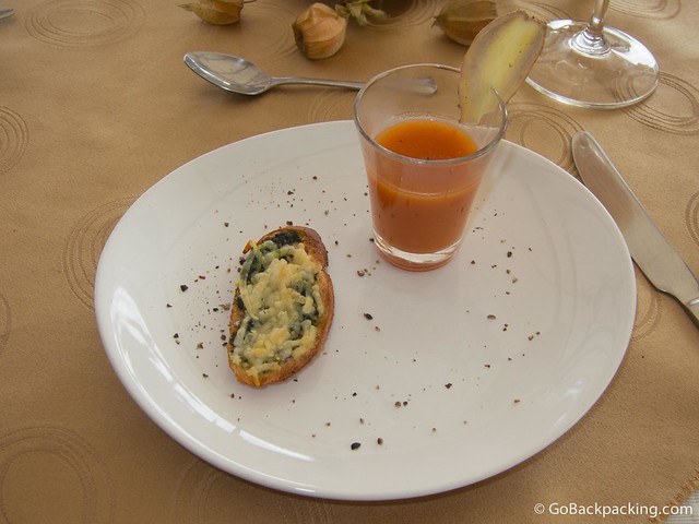 Tomato soup First course: tomato soup with ginger and a green crostini