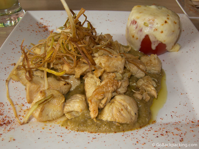 Green mole with chicken Green mole with chicken, and a stuffed tomato topped with cheese