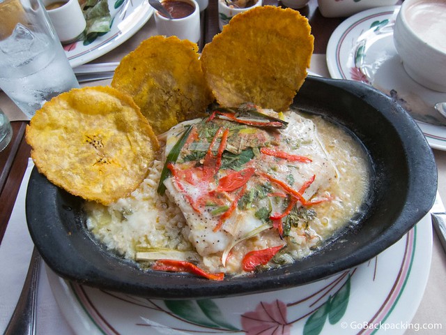 Cazuela de Pescado Robalo filet served over rice with a sour orange sauce, onions, sweet peppers, tomatoes, limoncillo and cilantro